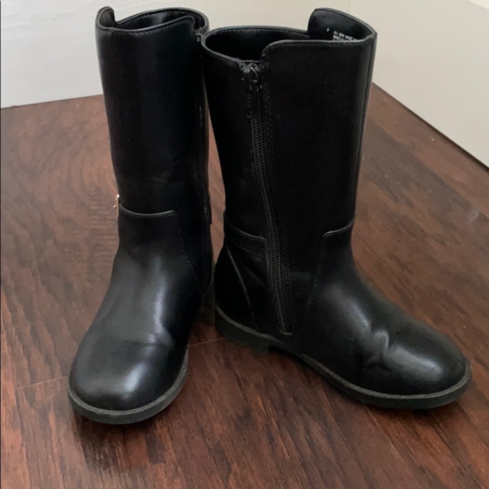 Little girl riding boots